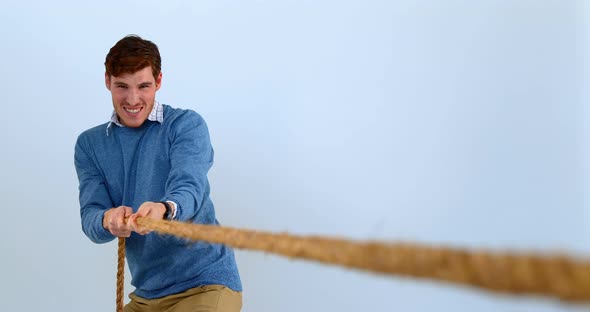 Man pulling a rope tug of war 