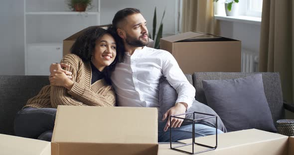 Newly Married African American Girl and Caucasian Man Husband and Wife Multiracial Couple Sitting