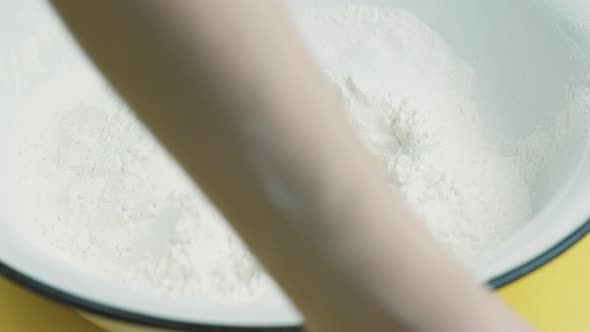 A Woman Preparing Dough in Kitchen