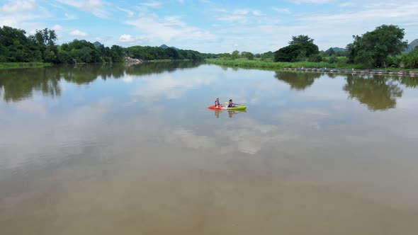 Couple Men and Women in Kayak on the River Kwai in Thailand