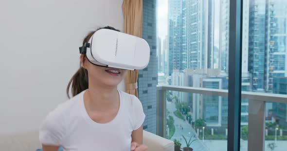 Woman play VR at home