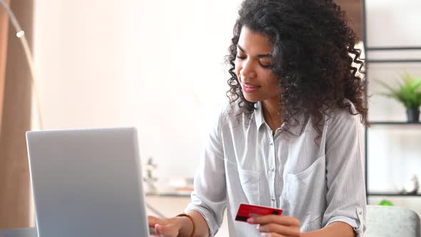 Smiling African American Woman Shopping Online