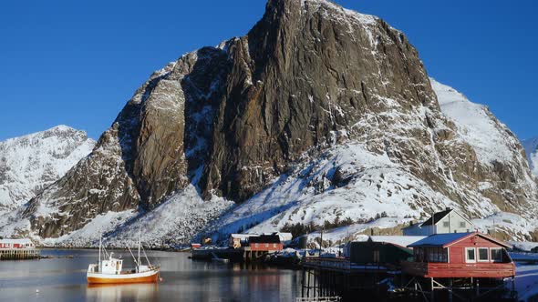 Norwegian Winter Landscape With The Multicolored Rorbu And Fishing Ships