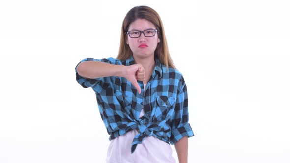 Angry Young Asian Hipster Woman Giving Thumbs Down