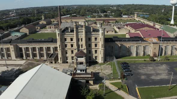 Aerial view of the derelict and abandoned Joliet prison or jail, a historic place. Droneing towards