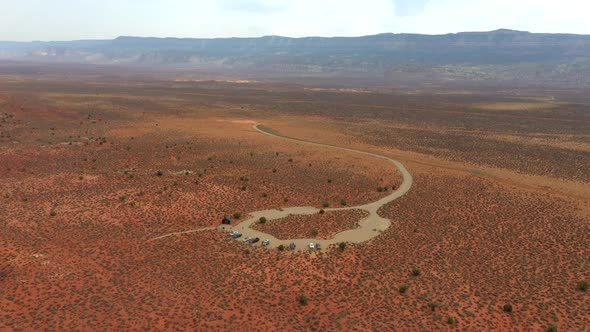 Cars Parked In The Desert Road In The Middle Of Nowhere In Utah. - Drone Orbit Shot