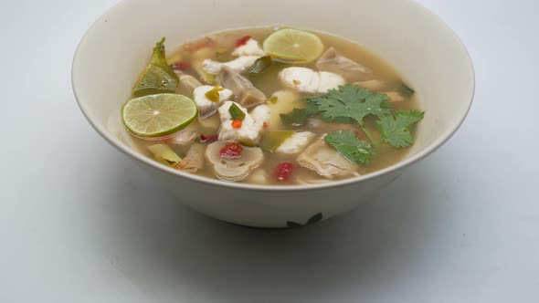 Close-Up Footage of Clear Tom Yum Soup With Sea Bass and Mushroom, The Famous Thai Food Well Known B