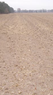 Vertical Video of a Field with Plowed Land in Autumn Slow Motion