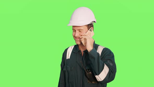 Young Happy Seaman Talking with Family on Mobile Phone and Smiling on Green Screen