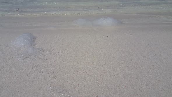 Tropical birds eye tourism shot of a white sand paradise beach and turquoise sea background in best 