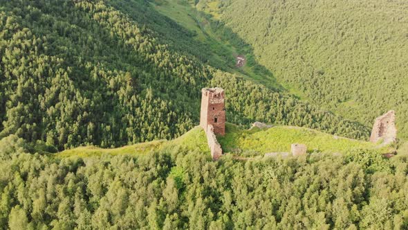 Isolated Aerial View Of Tower Ruins Up The Mountain In Ushguli