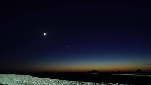 Base Camp of Tourists on Offroad Vehicles in the Desert in the Evening Time Lapse