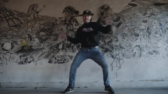 Modern dance in an old building - graffiti background