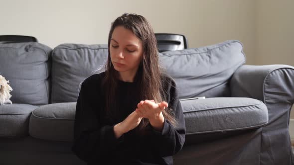 Self Care at Home Young Woman Applying Natural Oil on Wet Hair