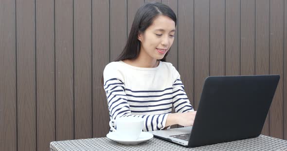 Woman working on laptop computer