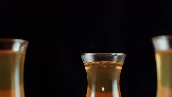 Black Tea in Armudu Glasses on Black Background