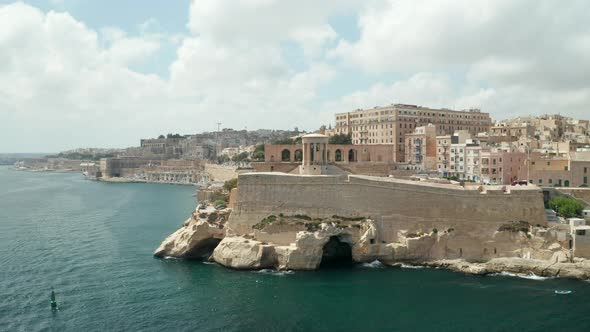 Famous Siege Bell War Memorial in Valletta, Malta Capital City, Aerial Drone Backwards, Revealing a