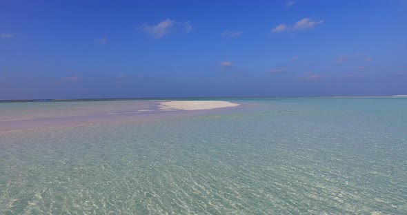 Natural above abstract shot of a white sandy paradise beach and aqua turquoise water background in b