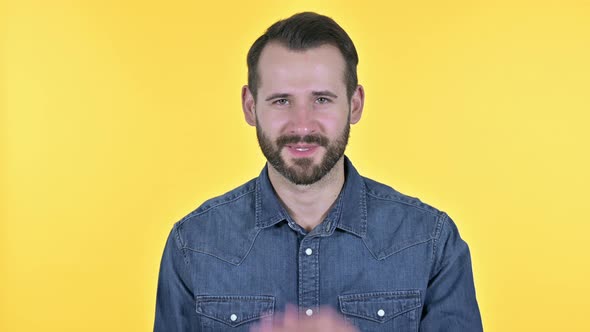 Beard Young Man Giving Flying Kiss, Yellow Background