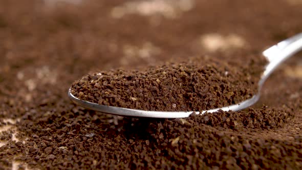 A spoonful of ground roasted coffee