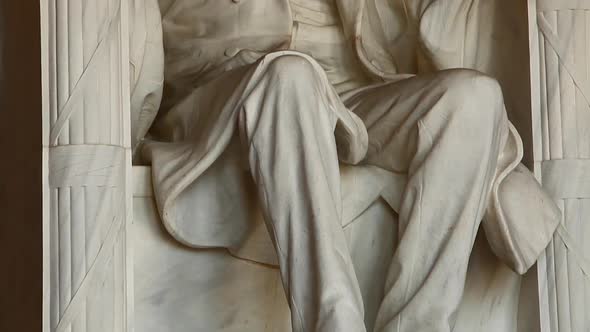 Tilting shot of the Abraham Lincoln statue inside the Lincoln Memorial in Washington DC