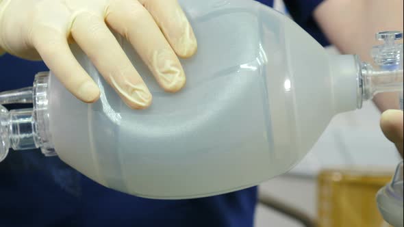 Anesthesiologist with Resuscitation Breathing Bag or Ambu Bag in Hands