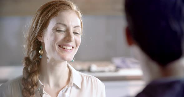 Redhead Woman Passing Bread