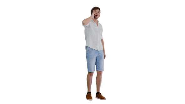 Happy Young Man Talking on Mobile Phone and Smiling on White Background