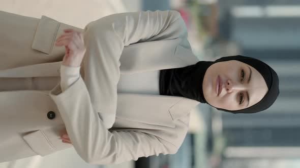 Woman in Hijab and Formal Clothes Standing with Crossed Arms