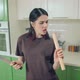 Young Woman Singing and Dancing with Knife and Roller at Home Kitchen - VideoHive Item for Sale