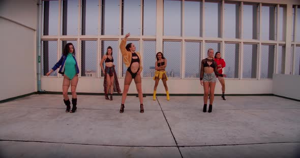 Female Dance Crew Performing On Rooftop