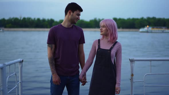 Live Camera Zoom in to Happy Smiling Couple Holding Hands Looking at Each Other Standing Outdoors