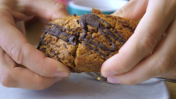 Hands Breaking Healthy Organic Vegan Bar in Half.