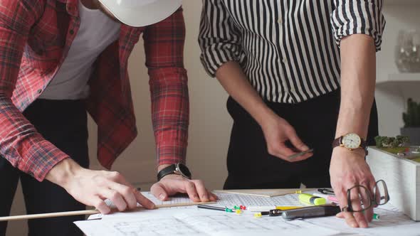 Young Engineer Man Mastering New Knowledge By Professional Architect