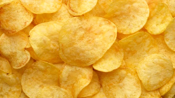 craft potato chips with cheddar cheese, rotating close up