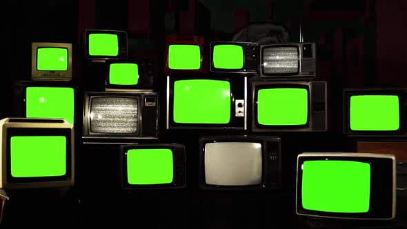 Fifteen Retro TVs turning on Green Screens with Static.