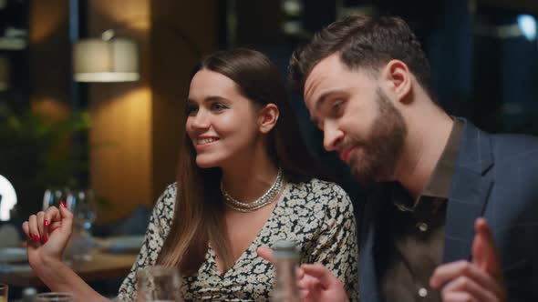 Fun Couple Enjoying Restaurant Party on Informal Business Meeting at Fancy Bar