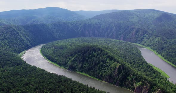 Climbing Up Above the Bend of the River in the Taiga