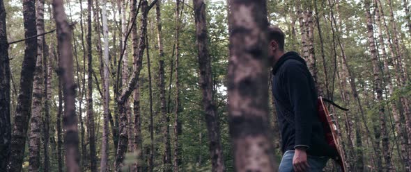 Guitar Player in the Woods