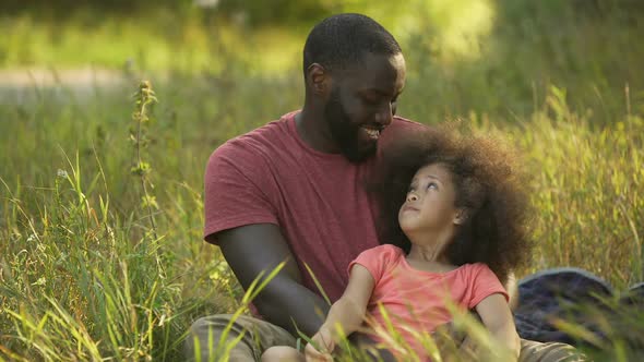 Single Parent Father Taking Care of Treasured Little Daughter With Curly Hair