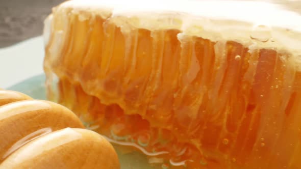 Honey, Honeycomb with Special Spoon on a Plate