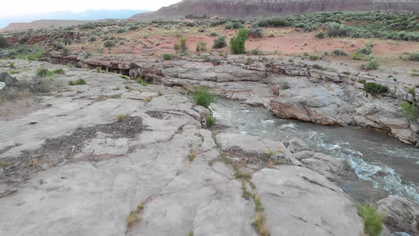 A scenic river running through red rock basin.