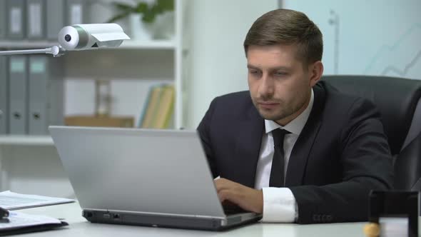 Sleepy Business Person Typing on Laptop and Yawning, Overworking Problem