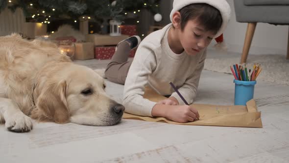 Little Boy Writing Letter to Santa Clause