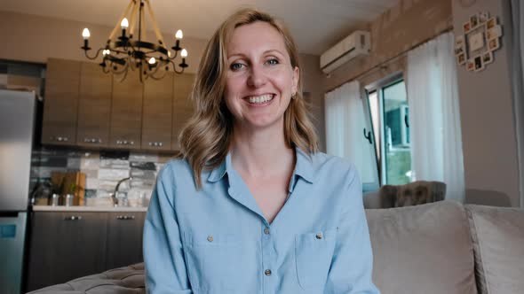 Woman Wave and Greet Into Webcam Have Video Call on Kitchen with Friend Rbbro