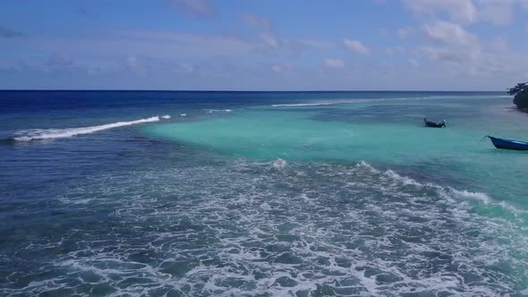 Aerial drone seascape of coast beach by blue sea with sand background