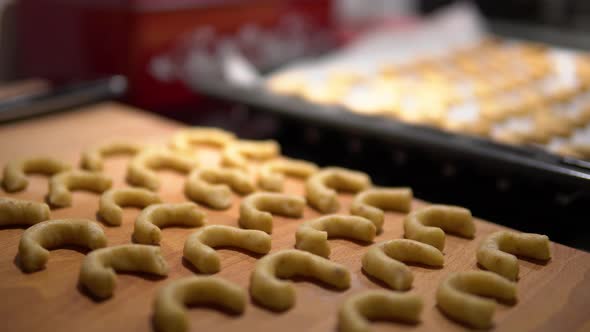 Raw Cookies on a Pan Inside an Oven and Outside of an Oven.