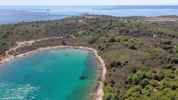 Vertical movie of flight over the cliffy coast near Rovinj in Croatia during daytime