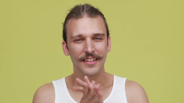 Young Cheerful Caucasian Man Doing a Winner Gesture Closeup