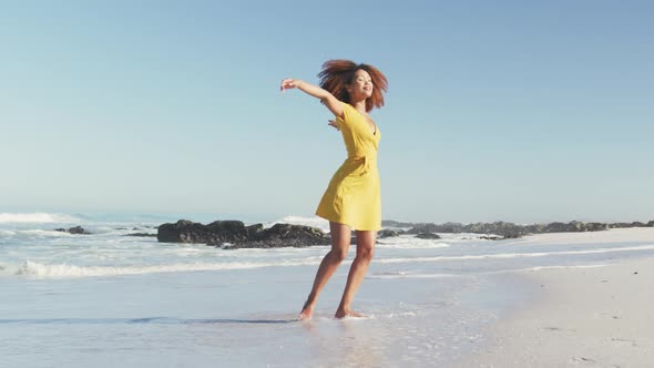 African American woman enjoying the beach